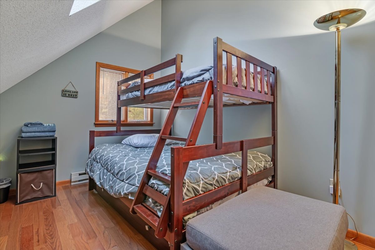 Bunk room with full-over-full bunk bed and lake life decor