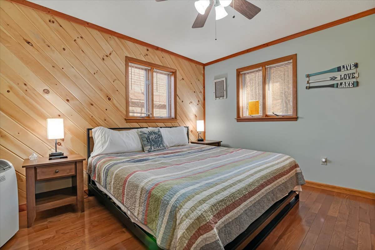 Cozy bedroom with rustic wood walls